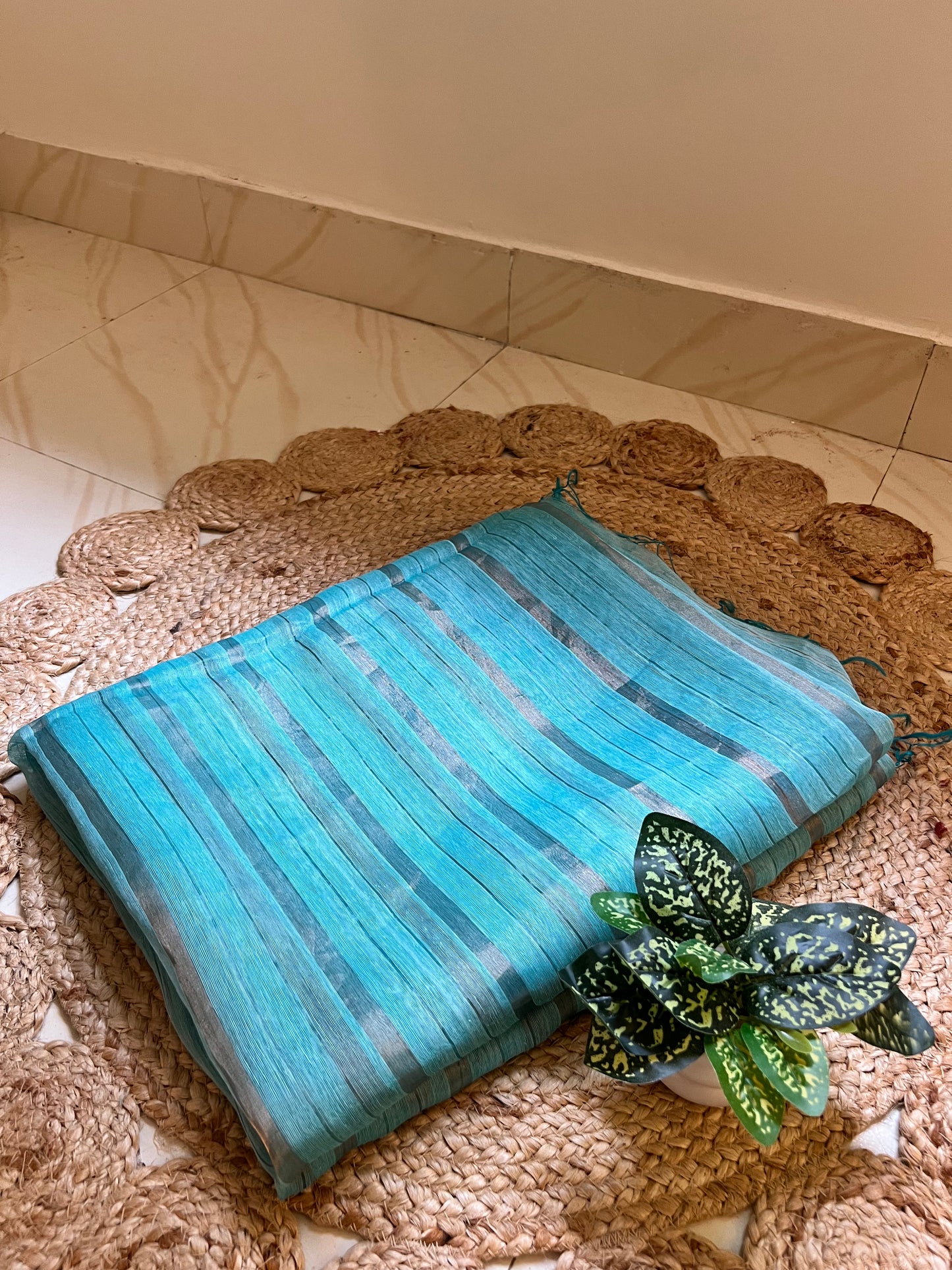 Close-up of zari stripes on sky blue pure linen silk saree