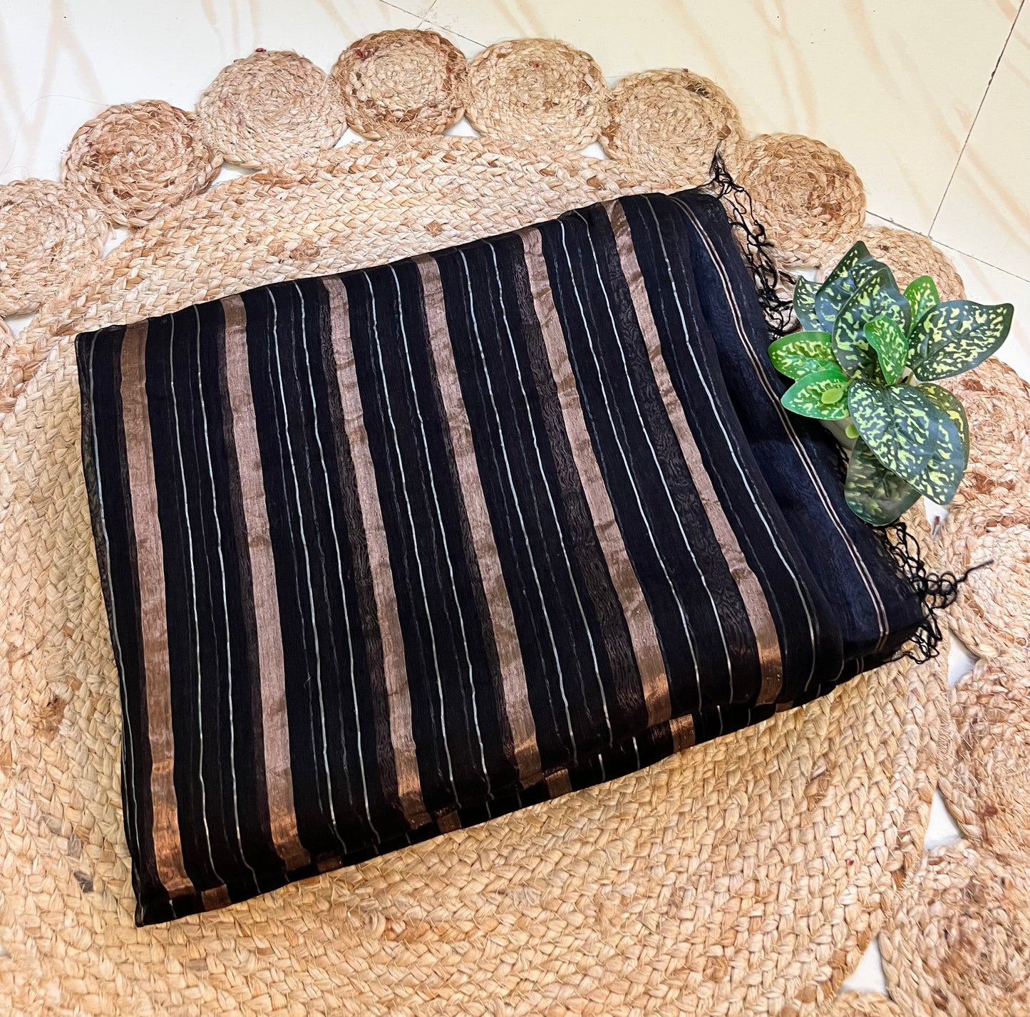 Close-up of zari stripes on black pure linen silk saree