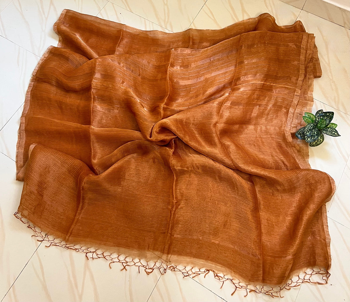 Mustard linen silk saree pallu with tassels and zari stripes