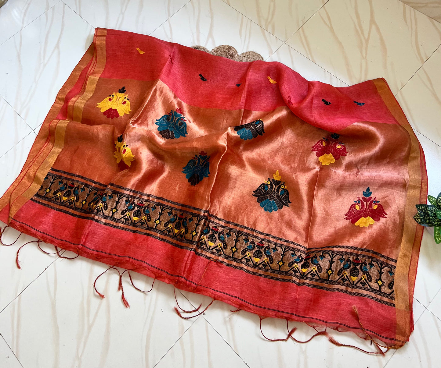 Coral red handloom saree pallu with Paithani-style peacock motifs

