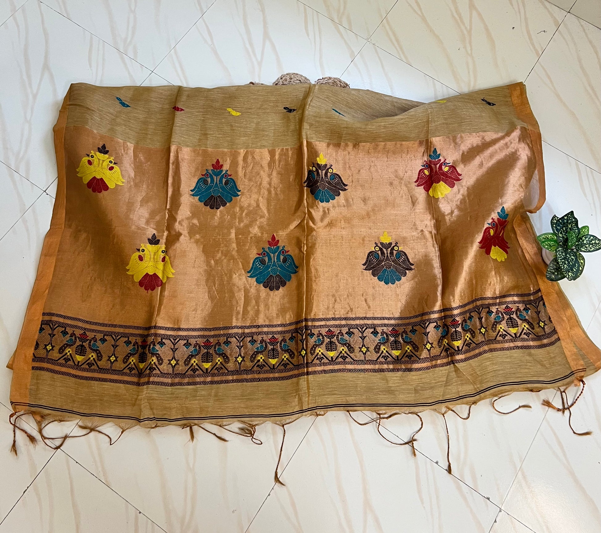 Golden tan handloom saree pallu with Paithani-style peacock motifs