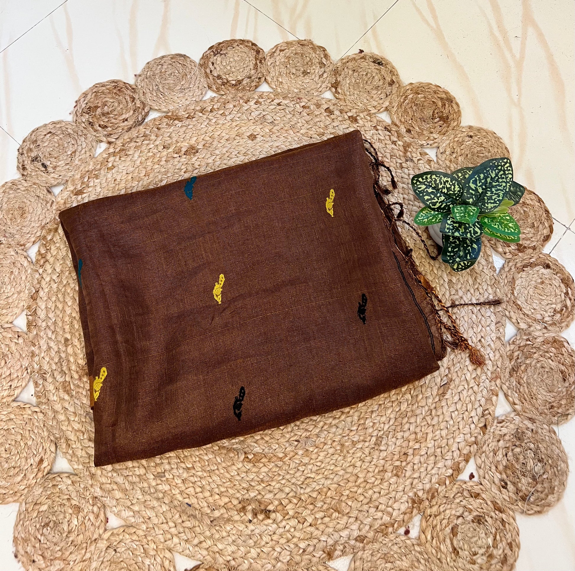 Close-up of bird motifs on mocha brown handloom linen silk saree