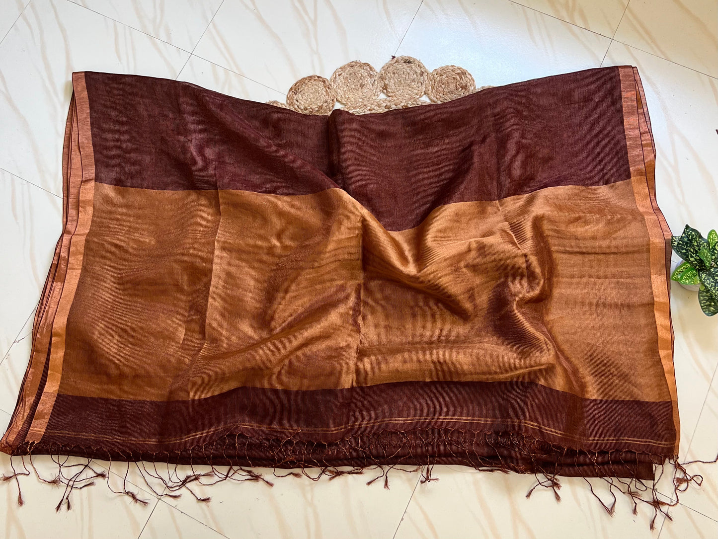 Brown linen silk saree pallu with tassels and zari work

